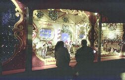 Locals, tourists, and passer-bys stop to admire New York store's enchanting Christmas window decorations