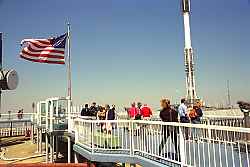 The United States Flag flying proudly atop the taller of the two towers.