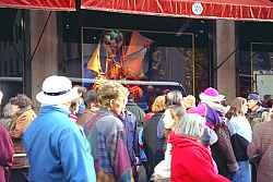 A Crowd gathers to see a display.